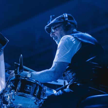 Phil plays the drums